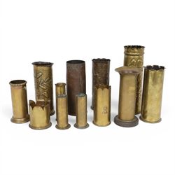 Eleven tench art shell case vases, including examples decorated in relief, with flowers, l...