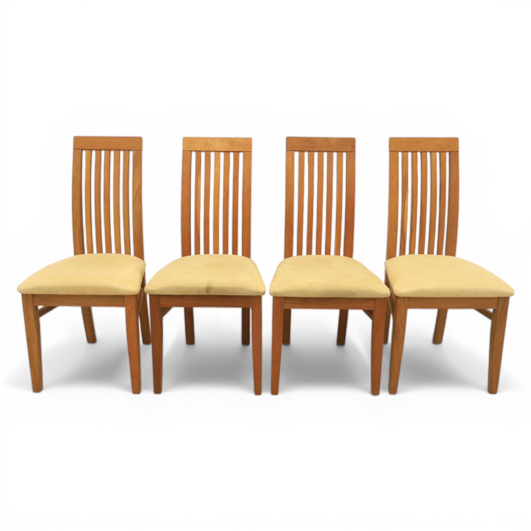 Contemporary teak dining suite comprising extending table and eight chairs, the table with rectangular plank top and one additional leaf extending to 210cm, supported on square tapering legs, the chairs with tall slatted backs and cream upholstered seats