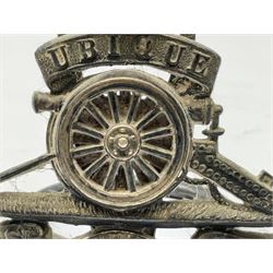 Trench Art - three WW2 brass shell case ashtrays, one mounted with Royal Artillery cap badge and button and one mounted with RA button; together with a pair of place name holders each formed from a Royal Artillery cap badge (5)
