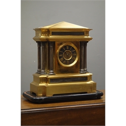  20th century brass architectural mantel clock, fluted Corinthian columns, twin train movement with Arabic dial, on ebonised plinth, W40cm  
