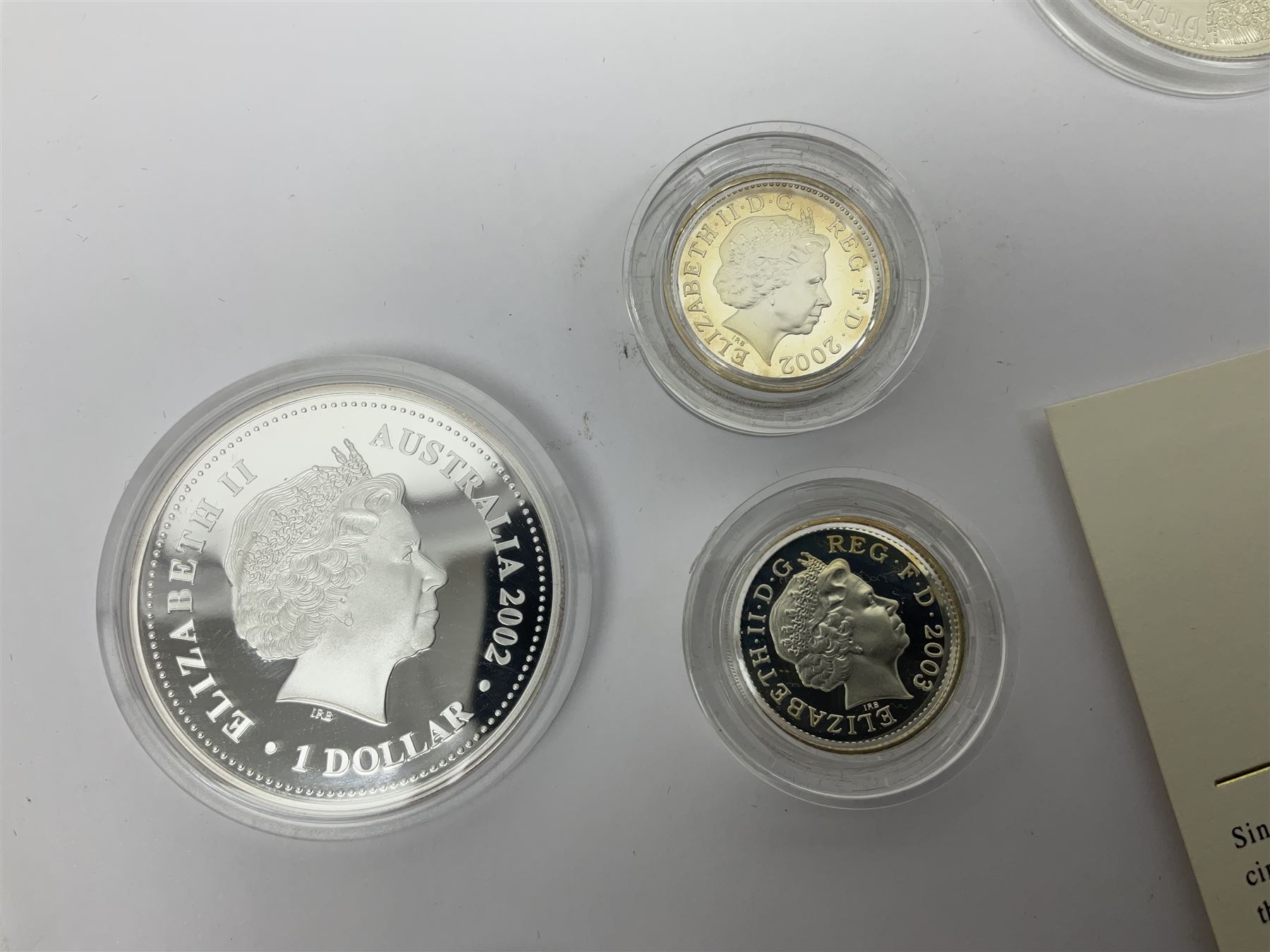 Thirteen silver coins, including Queen Elizabeth II Solomon Islands 2002 sterling silver five dollars, Alderney 2002 sterling silver five pounds, Fiji 2002 sterling silver ten dollars, United Kingdom 2003 one ounce fine silver Britannia, 2003 'Give Women The Vote' fifty pence etc, all with some form of certificate