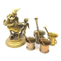 20th century brass sculpture group of three winged Cherubs with a Goose, H37cm together with four bronze pestle and mortars 