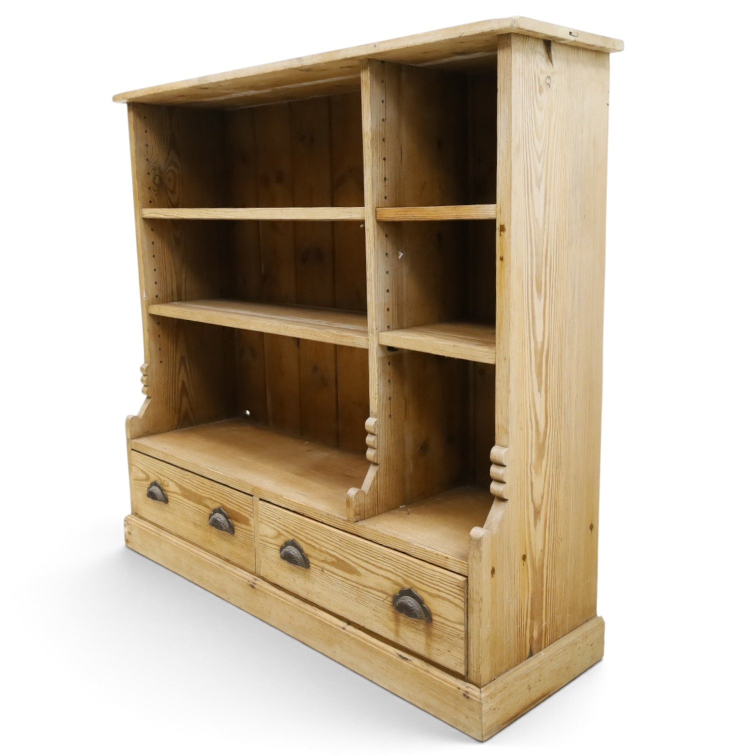 Late Victorian stripped pitch pine open bookcase, fitted with four adjustable open shelves, two drawers fitted to base with pull handles, on skirted base 