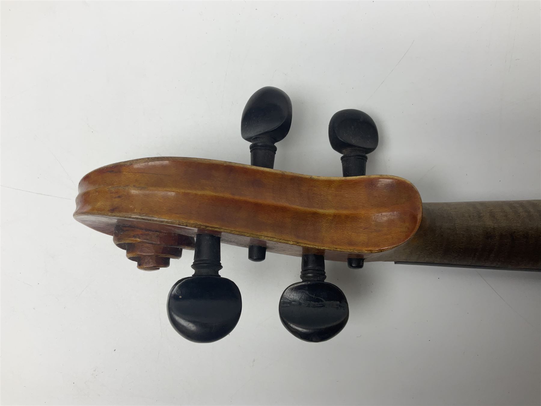 German trade violin c1900 copy of a Maggini with 36.5cm two-piece maple back and ribs and spruce top; double scroll; L60cm overall; in carrying case