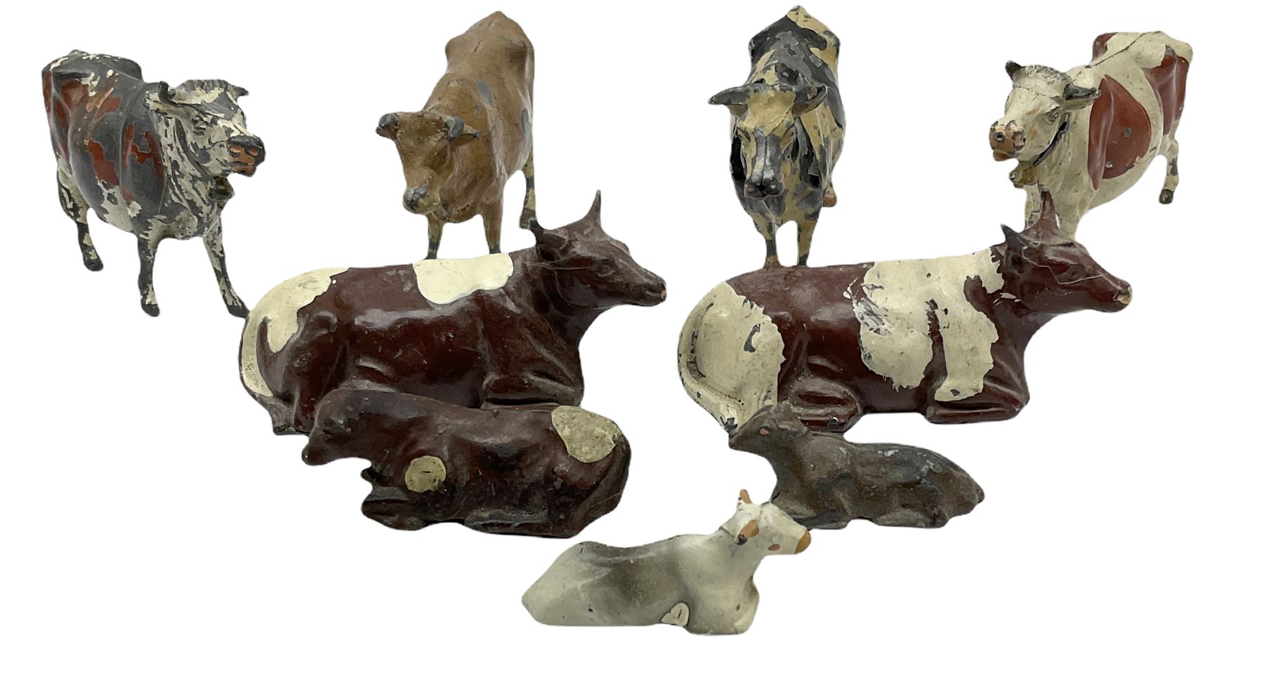 Britains Nestles 'The World's Cow' decorated with map-of-the-world pattern L8cm; and eight other various sized lead figures of cows, standing or reclining, by Britains, Hill & Co etc (9)