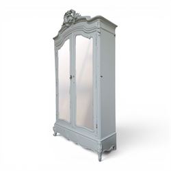 French Louis XV style pale blue painted armoire, with carved floral and foliate crest over a shaped moulded cornice, fitted with two bevelled mirror panel doors enclosing hanging space and drawer, above shaped apron, raised on carved cabriole supports