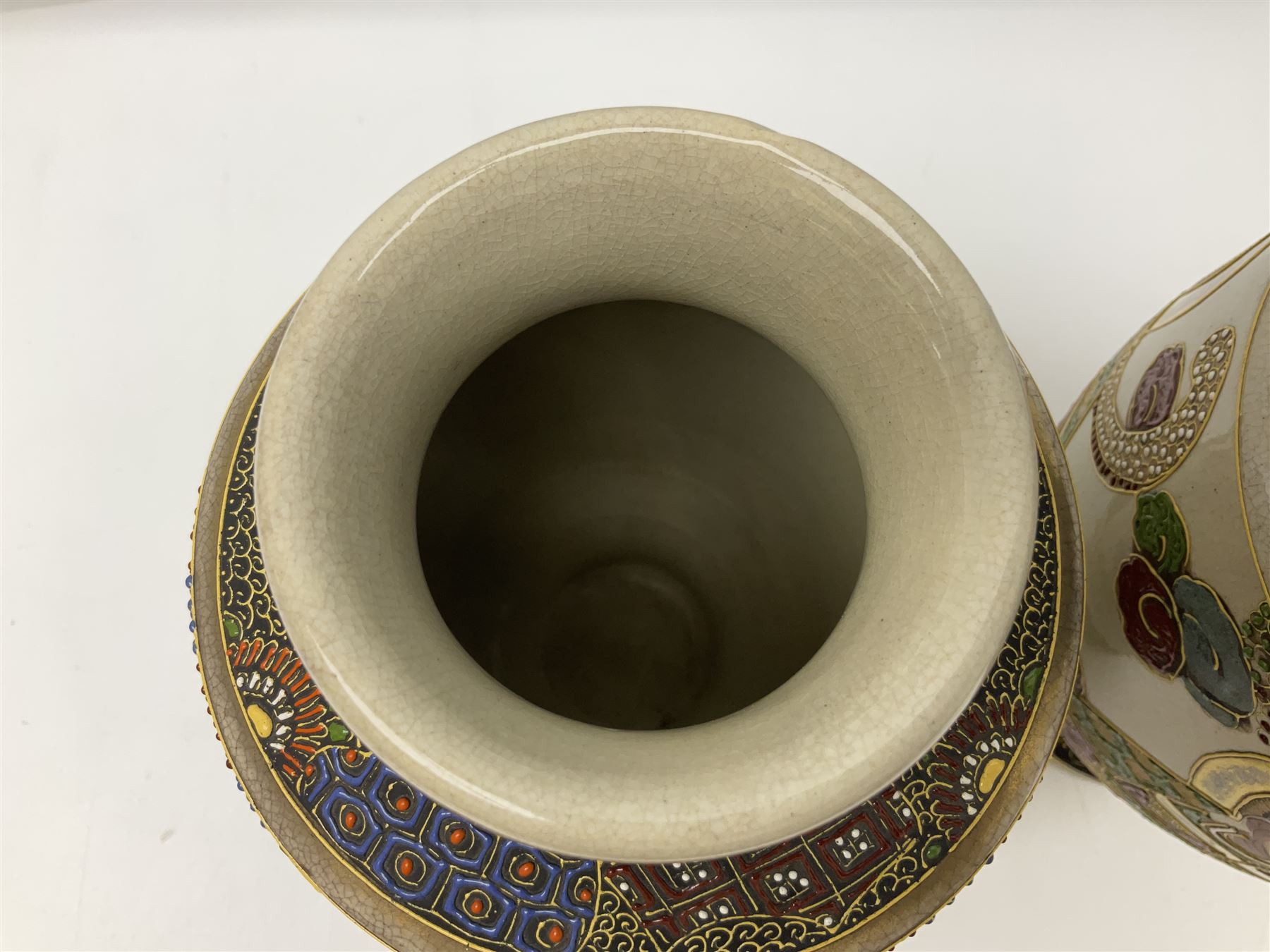 Pair of early 20th century Japanese Satsuma vases, decorated with immortals, with painted mark to base, H26cm