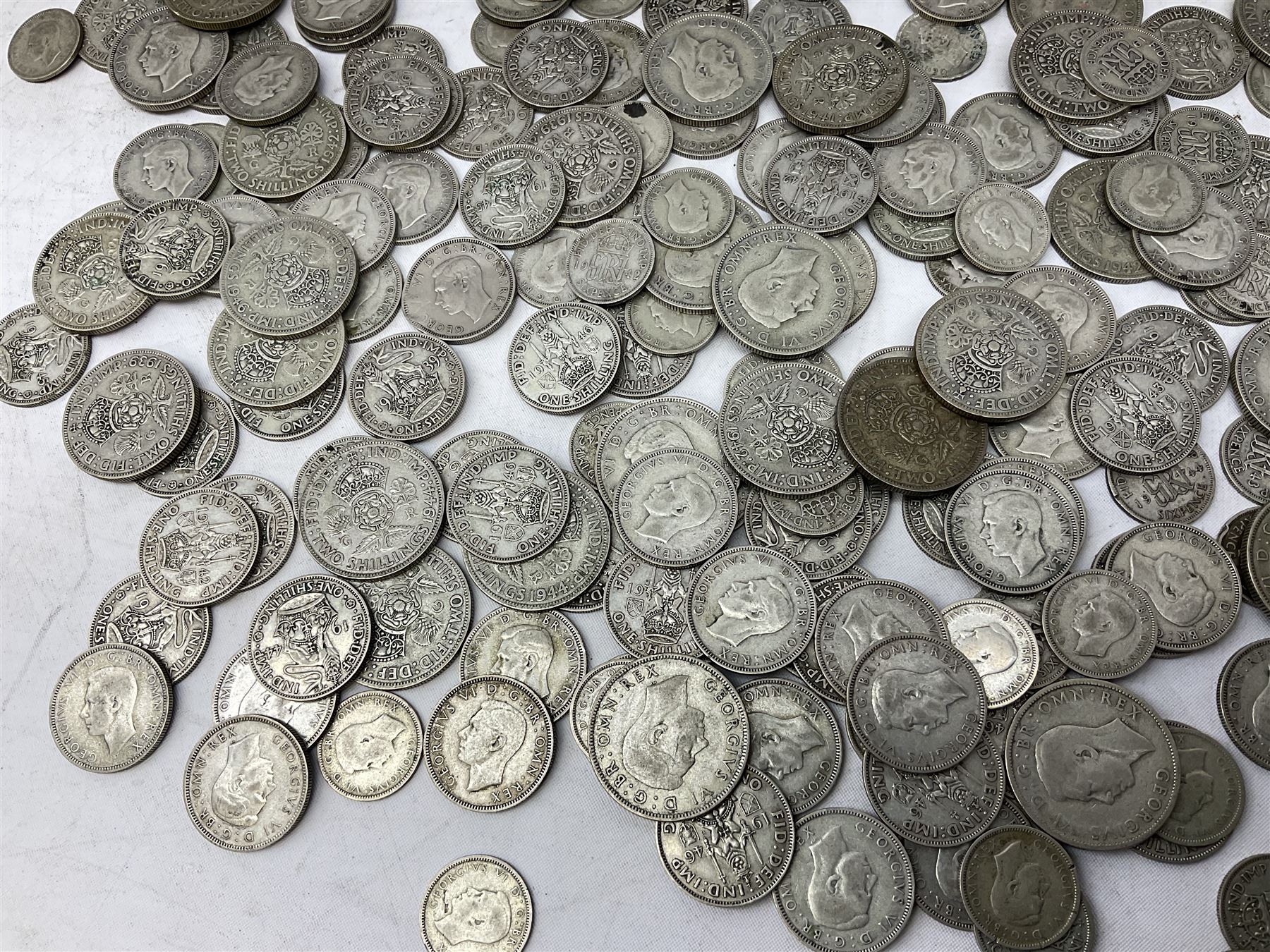Approximately 1460 grams of pre 1947 Great British silver coins, including sixpences, shillings and two shillings 