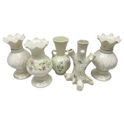 Five late 19th/early 20th century and later Belleek vases, comprising pair of Lotus Blossom examples, shamrock tree trunk vase, twin handled shamrock vase and a baluster form vase decorated with applied roses, all with printed marks beneath, tallest H16cm