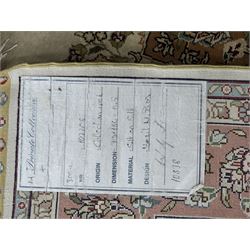 Finely knotted silk on silk ivory ground runner (L185cm,  W76cm), overall floral design together with a prayer rug (L94cm, W63cm)