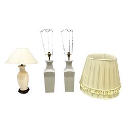 Pair of grey ceramic table lamps, together with another lamp on a wooden plinth and three lampshades