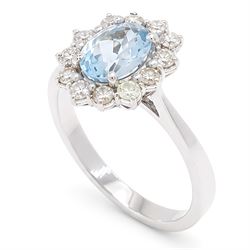 18ct white gold aquamarine and diamond cluster ring, single oval cut aquamarine of approx 0.85 carat, surrounded by twelve round brilliant cut diamonds, hallmarked, total diamond weight approx 0.50 carat