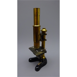  E Leitz Wetzlar black japanned and lacquered brass monocular microscope No.82601, with fine adjust, two objectives and two oculars, on horseshoe base, fitted case stamped 82584,    