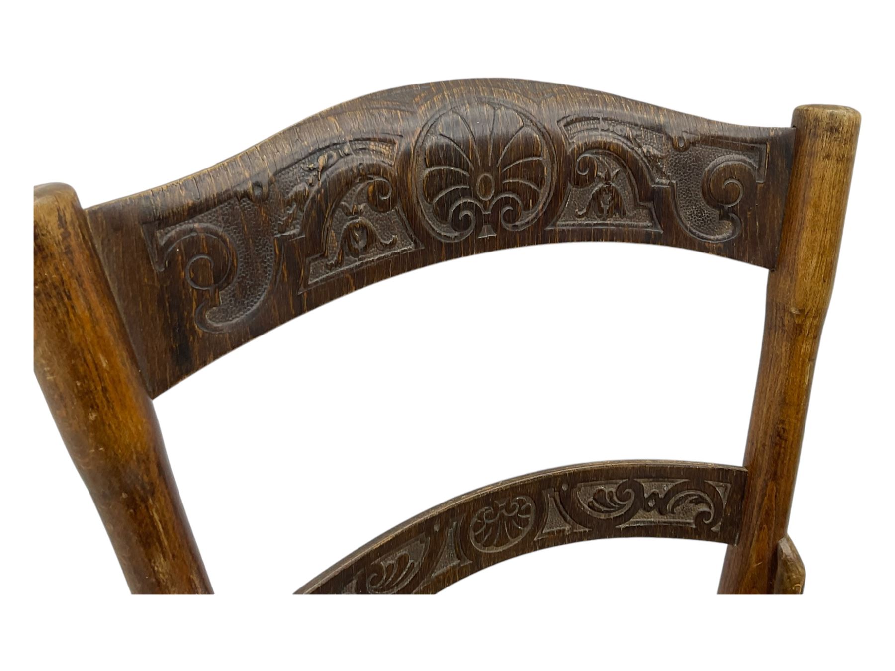 Jacob & Josef Kohn - set of four early 20th century Austrian bentwood chairs, each with carved decoration to the shaped backrest and shaped seat, on splayed supports with stretchers, marked with the manufacturer's stamp and paper label beneath