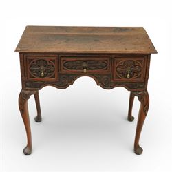 Early 20th century carved oak lowboy, rectangular moulded top above three short drawers ca...