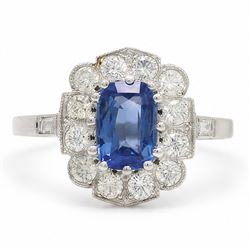 Platinum sapphire an diamond cluster ring, single modified cushion cut sapphire of approx ...