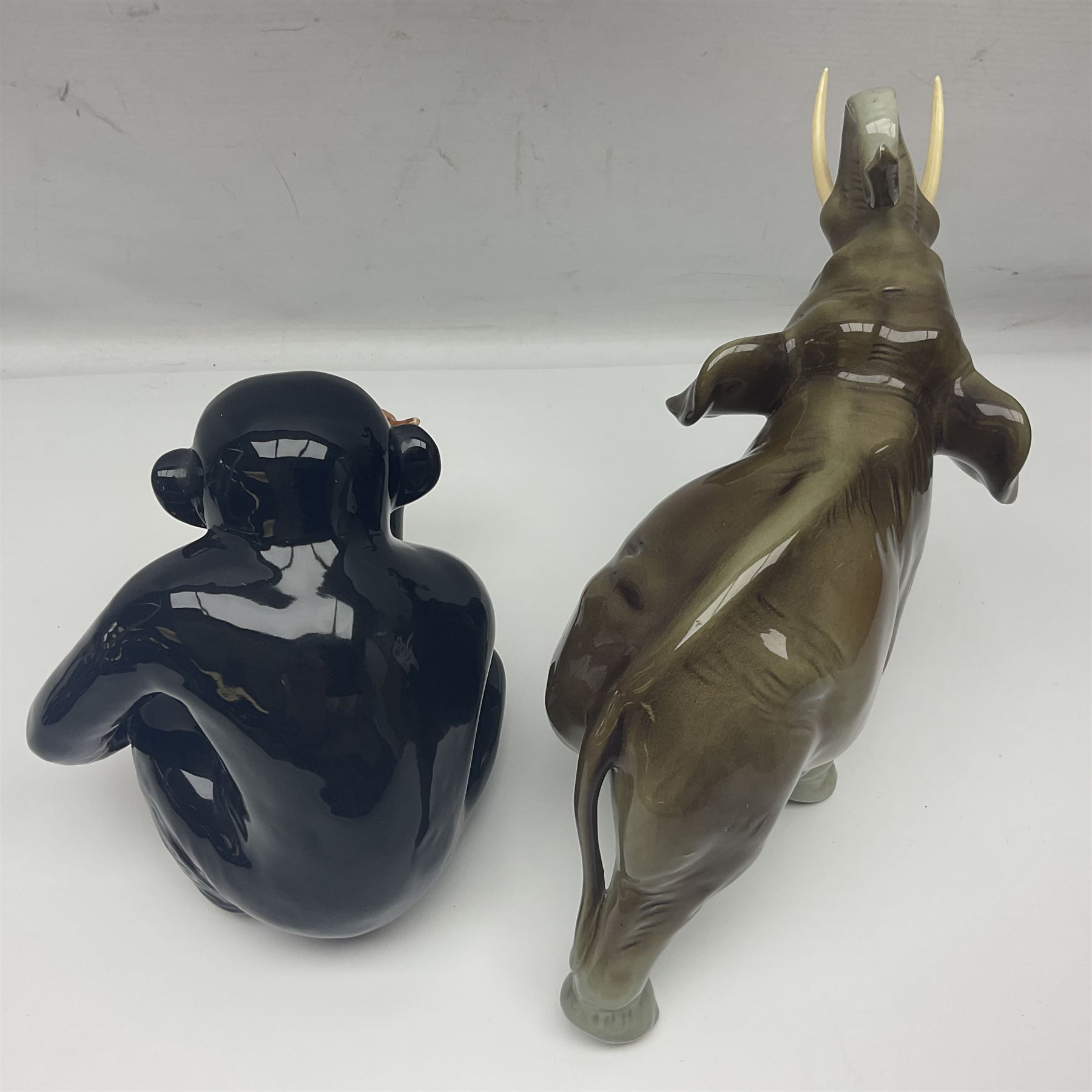 Large Sylvac monkey together with three smaller monkeys, together with Beswick Pigeon no 1383, Melba Ware hippo and baby and Royal Dux elephant 