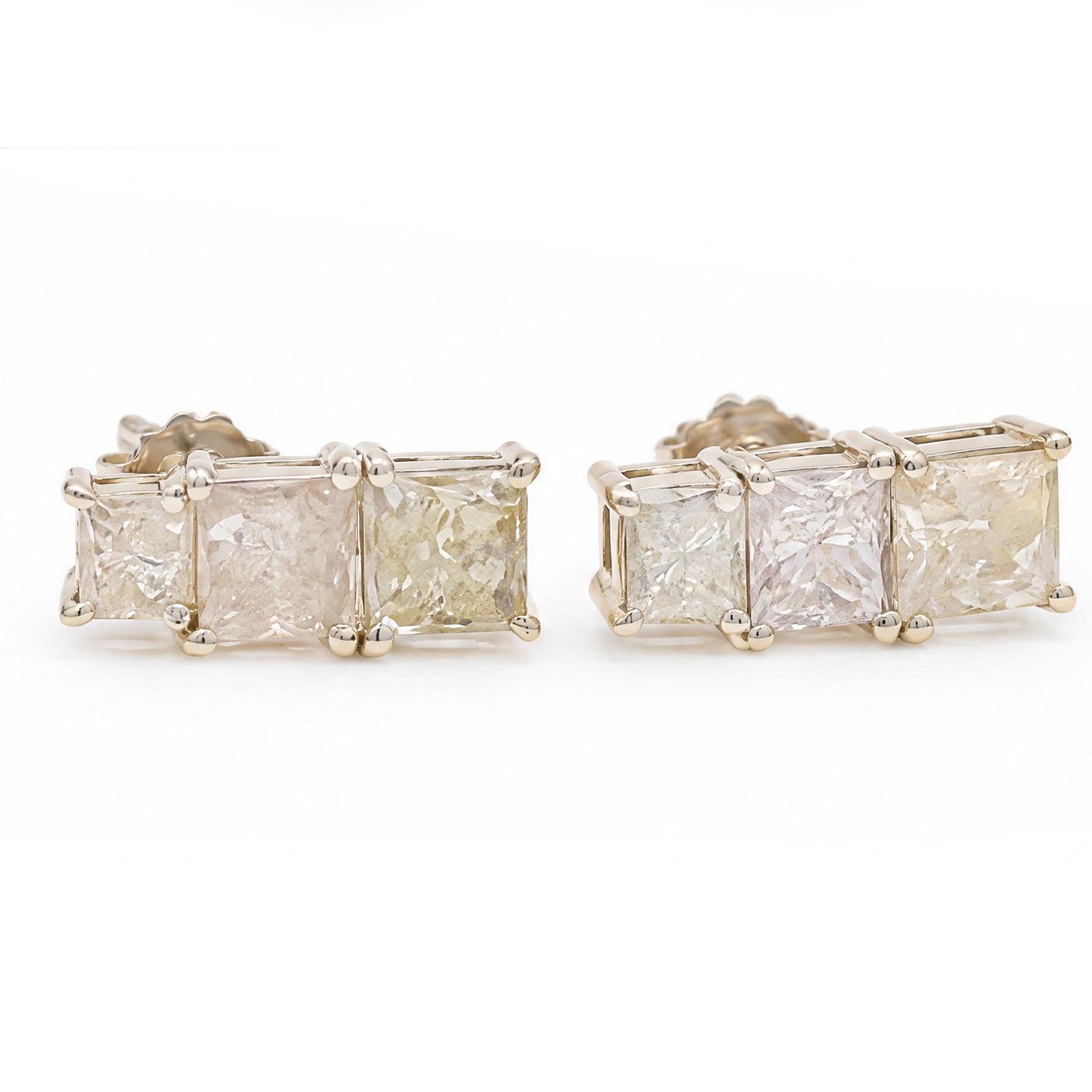 Pair of 18ct white gold diamond earrings, each stud set with three graduating princess cut diamonds, stamped 750, total diamond weight approx 1.70 carat
