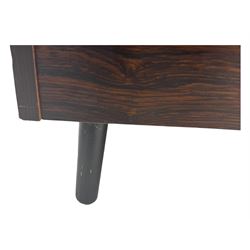 Troeds of Sweden - mid-20th century rosewood veneered cupboard, single door with brass handle enclosing interior fitted with one drawer, raised on ebonised tapered and splayed supports