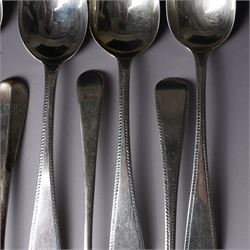 Set of six George III silver dessert spoons with bright cut stemsLondon 1818 Maker Thomas Wallis II and Jonathan Hayne, three other silver dessert spoons and a silver berry spoon with gilded bowl (10)