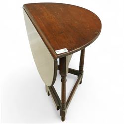 20th century oak drop-leaf table, of gateleg form with oval top, raised on turned legs and stretchers with twin gate supports