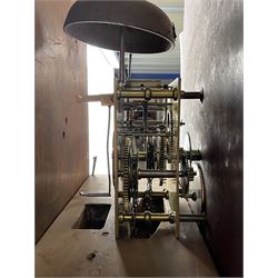 Early 19th century oak and rosewood banded longcase clock, scrolled pediment over stepped arch hood door, enamel painted dial indistinctly signed for a Penrith maker, 30-hour movement striking on bell