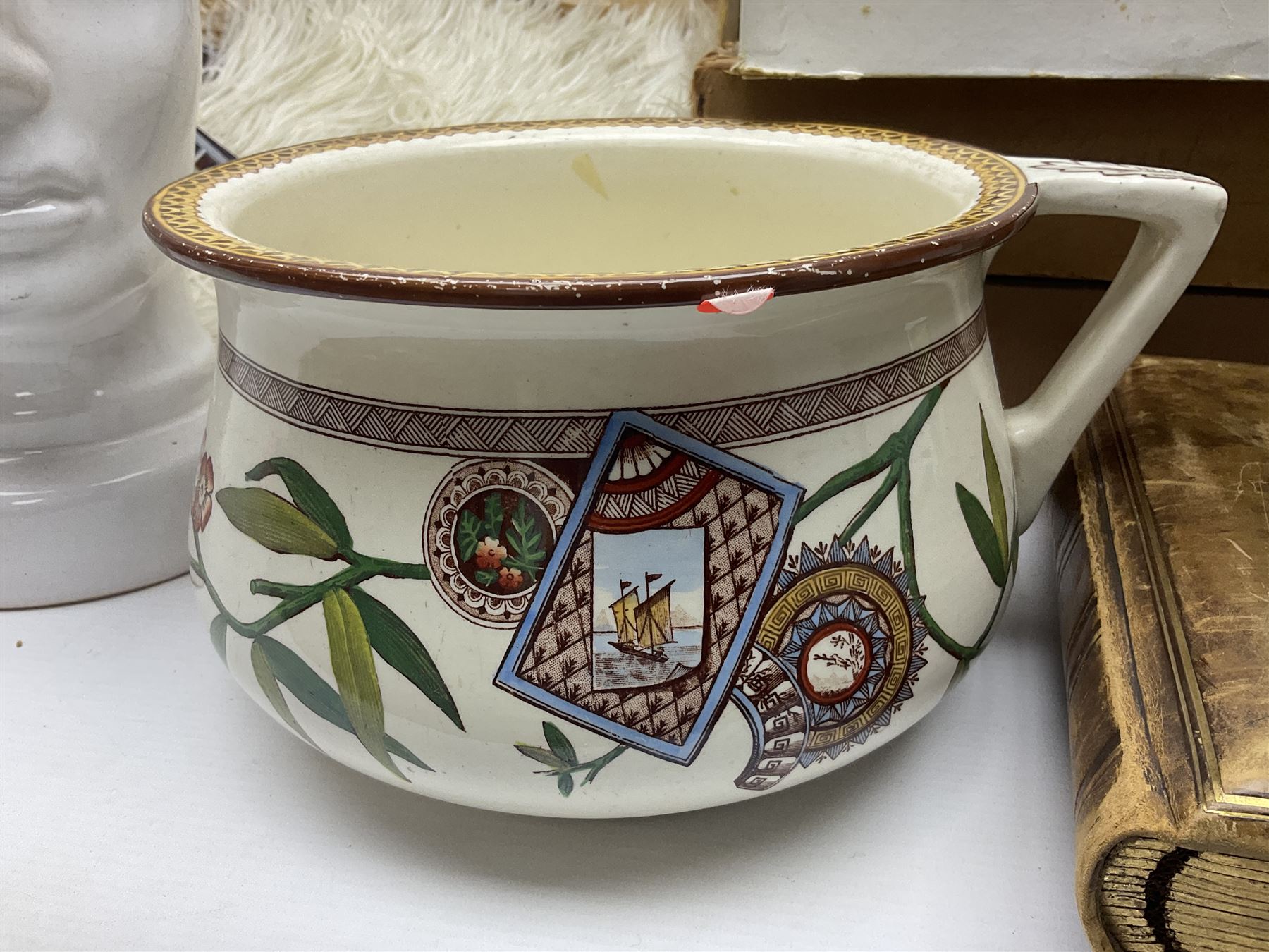 White Ostrich feather fan, together with ceramic head, leather bound photo book, Wedgwood chamber pot and other collectables 