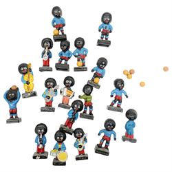 Eighteen gollywog figures, including jazz and football examples