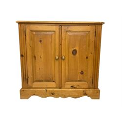 Rustic pine cupboard, fitted with two panelled doors enclosing two shelves