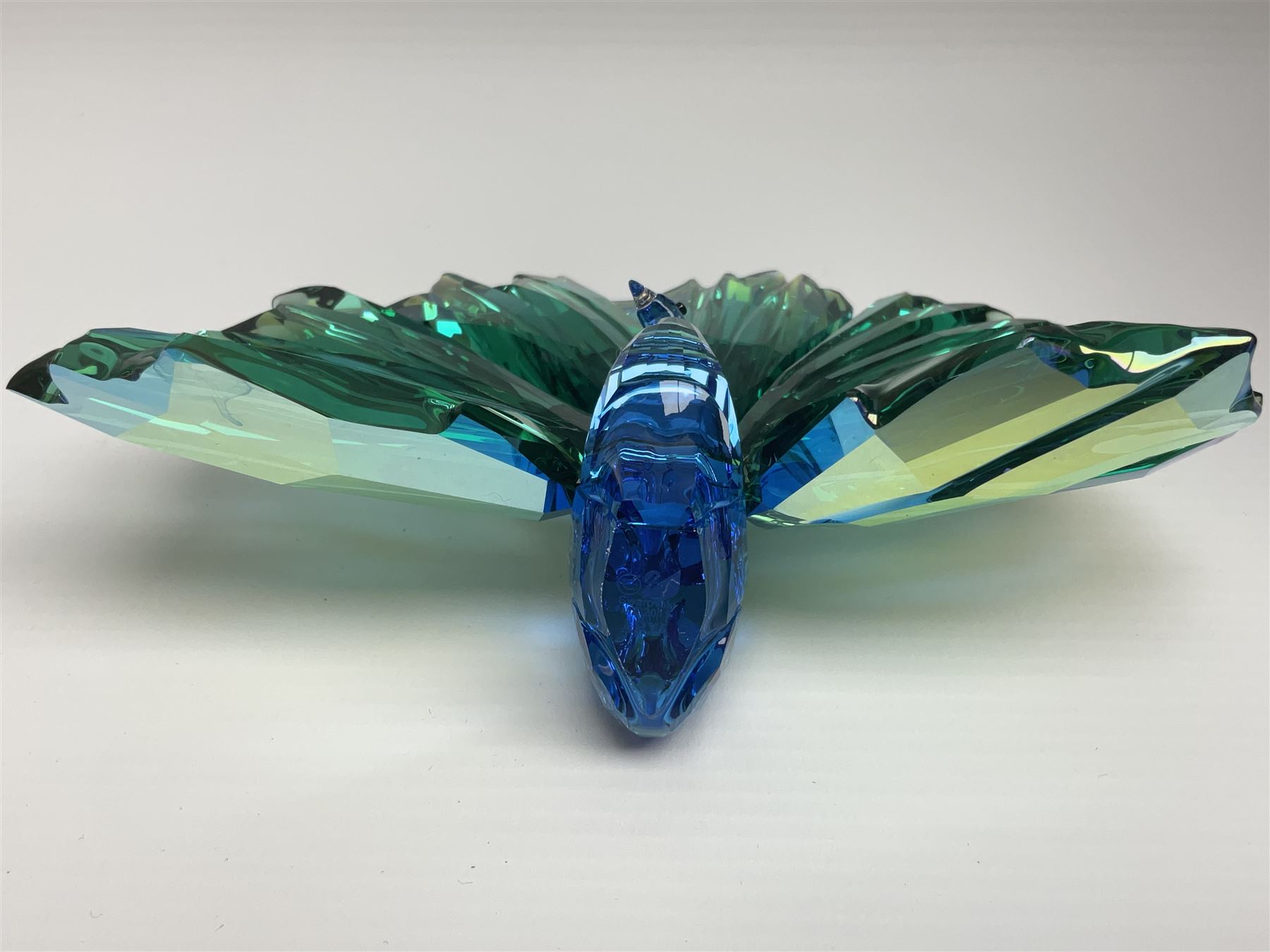 Swarovski Crystal SCS Edition peacock, Arya, together with a Swarovski Crystal peacock, perched on rock and small Swarovski Crystal sign, with peacock motif, tallest H11cm