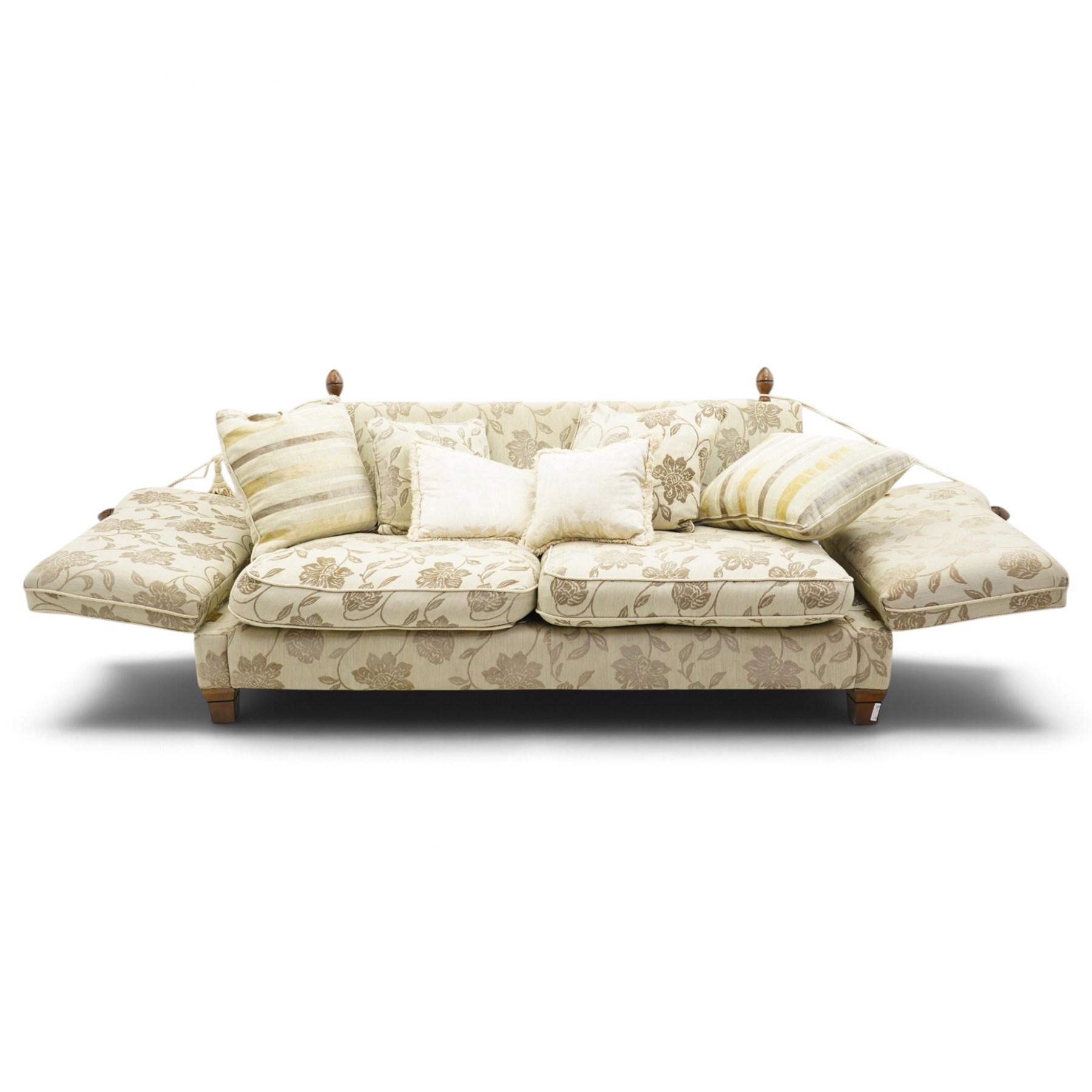 Traditional knoll sofa, upholstered in cream and olive floral fabric, adjustable drop ends secured by cords to turned finials, loose seat and back cushions with piped edges, on square tapering feet, with four scatter cushions