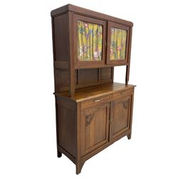Early to mid-20th century oak dresser, glazed cabinet over two drawers and cupboards, the doors carved with flower heads