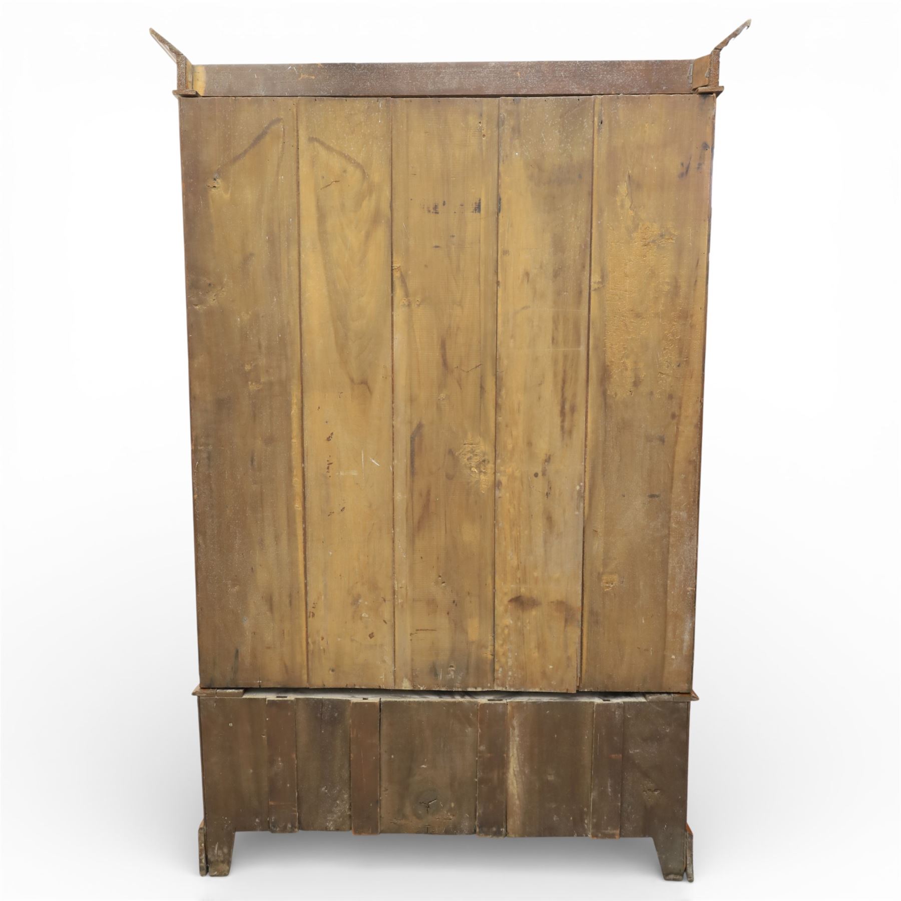 Early 20th century Art Nouveau walnut wardrobe, rectangular top over with single central mirrored panel door, the outer sides carved with sinuous foliate decoration and stylised stem motifs above recessed panels, single long drawer below with brass drop handles, on moulded plinth