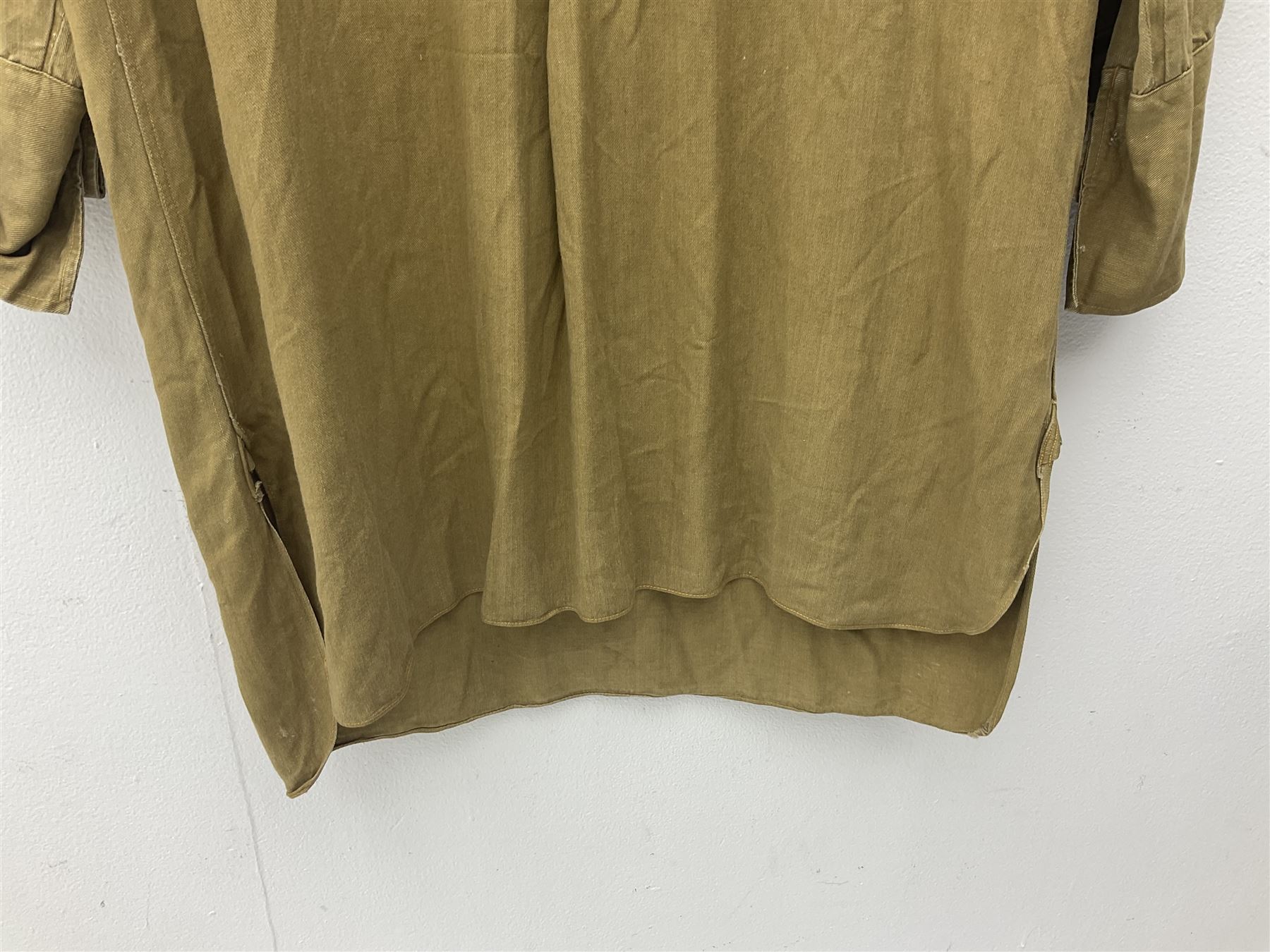 1930s Hitler Youth brown shirt, long length with two pockets, bears triangular badge 'Nord Nordsee'