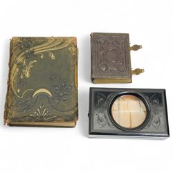 Small Victorian photograph album with metal clasps containing portrait photographs, anothe...