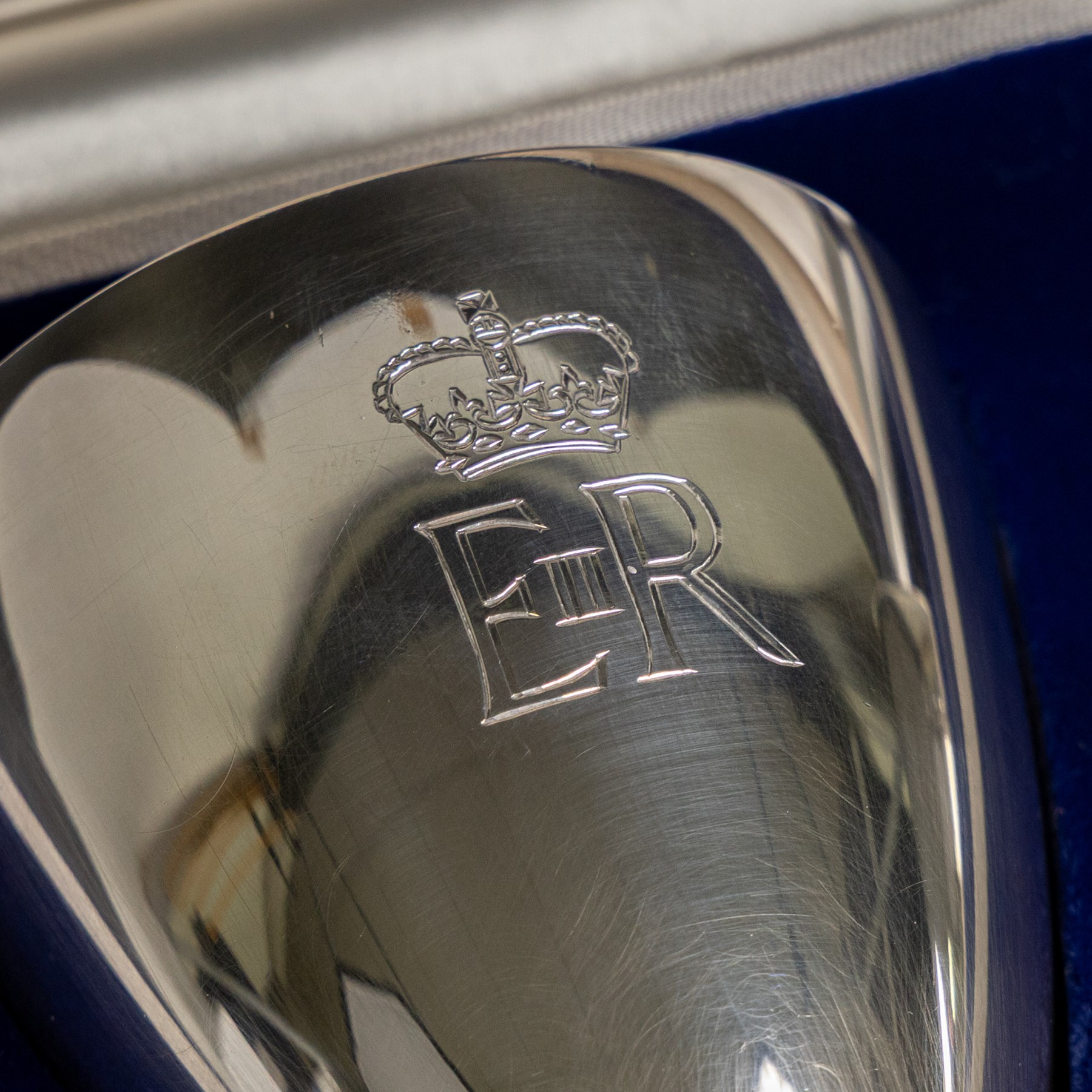 Pair of limited edition commemorative silver goblets, each engraved with HRH Queen Elizabeth's Royal cypher, the bowls with gilt interior and upon a parcel gilt stem, the circular foot engraved 'The Queen's Silver Jubilee 1952-1977', both hallmarked Mappin & Webb Ltd, Sheffield 1977, limited edition numbers 267 & 268/2500, boxed, H17cm