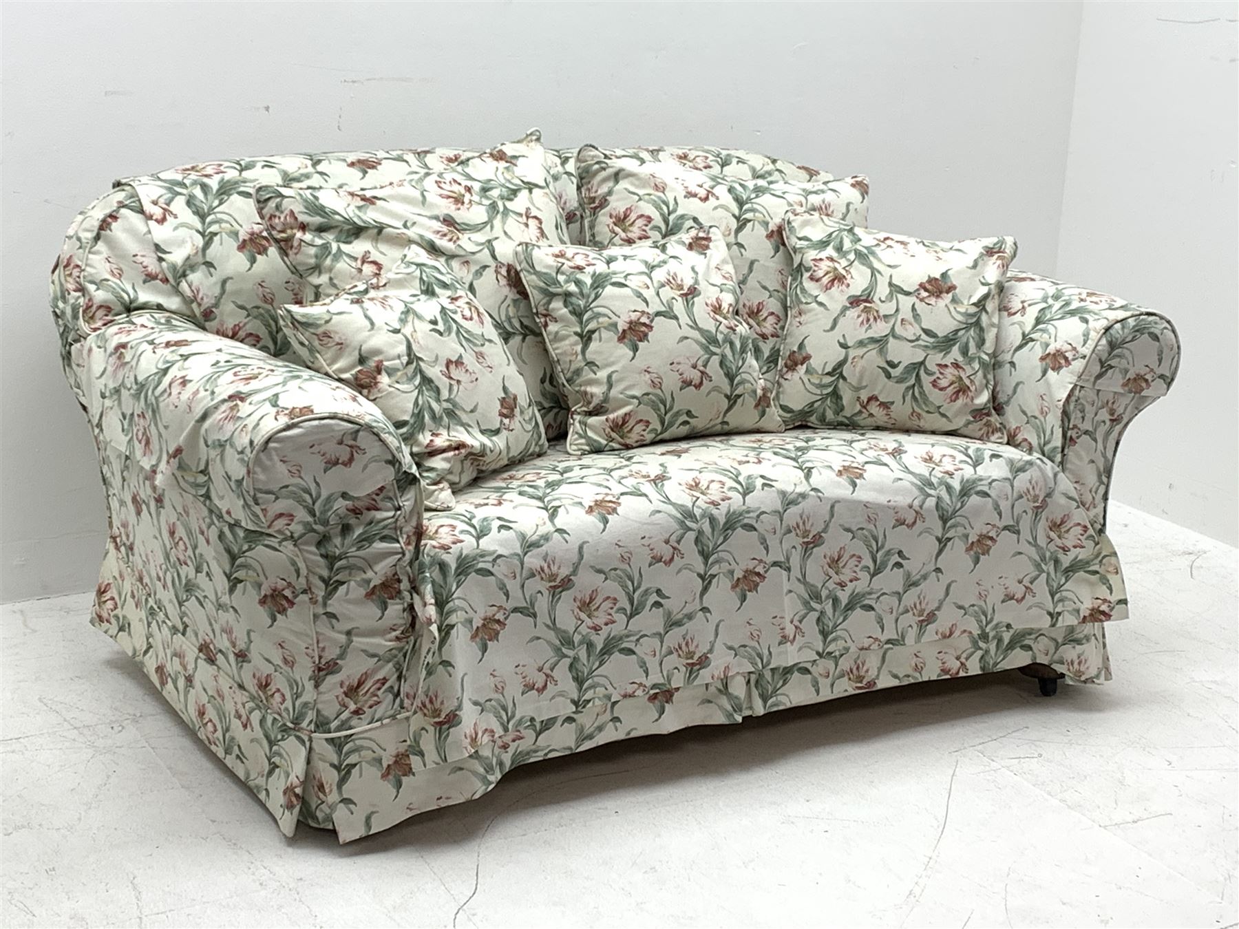 Early 20th century two seat settee with drop arm, upholstered in Sanderson 'Absalon Minor' fabric, loose covers and cushions, white ground with overall floral design
