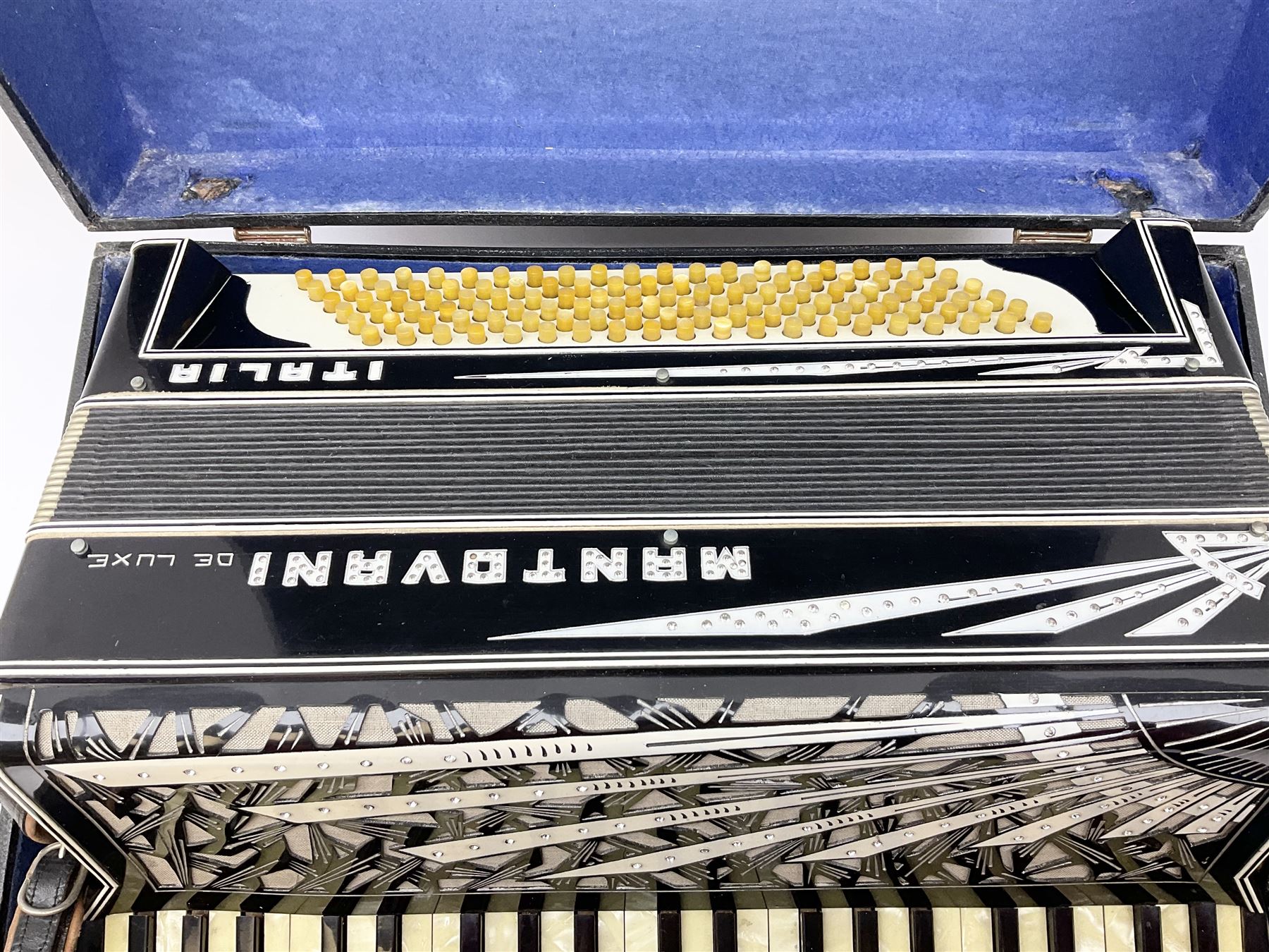 Italian Mantovani piano accordion with Art Deco style black and white case, twenty-four keys and one-hundred and twenty buttons L52cm in carrying case