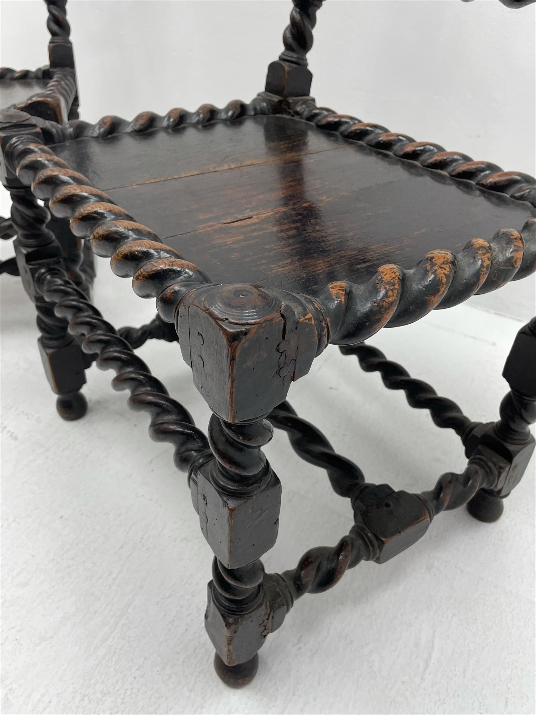 Unusual pair late 17th century oak spindle-back chairs, barley twist or spiral turned throughout, the back with a row of six vertical turned spindles, the supports joined by two lower rails and front central rail, plank seats

Provenance - The chairs illustrated in 'Early British Chairs and Seats 1500-1700' by Tobias Jellinek (Pub: Antique Collectors Club. 2009. p 313). Previous part of a private collection. Vendor purchased from auction 2014.

Measurements - seat width - 48cm, seat height - 38cm/36cm, depth - 50cm, total height - 85cm/82cm