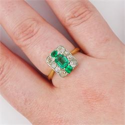 Early 20th century gold emerald and diamond panel ring, three octagonal cut emeralds, with four old cut diamonds set either side, stamped 18ct Plat, total diamond weight approx 0.85 carat