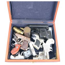 Large collection of lighters, including novelty gun and camera examples, Art Deco table lighter by Benlow Golmet, circular John F Kennedy example and other smoking accessories