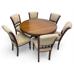 Victorian mahogany centre table, circular top above turned pedestal, terminating on three cabriole legs with scroll feet on porcelain castors, and six scroll carved upholstered dining chairs, with cushion and spindle turned backs, centre table  118x74cm, dining chairs 89x46x50cm