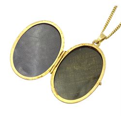 9ct gold oval locket pendant necklace, with engraved flower decoration, hallmarked