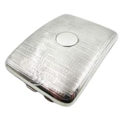 1920's silver cigarette case, of rounded rectangular form with central vacant circular panel to the front, and engine turned decoration to front and back, hallmarked Henry Matthews, Birmingham 1922, W11.5cm, approximate weight 4.27 ozt (133 grams)