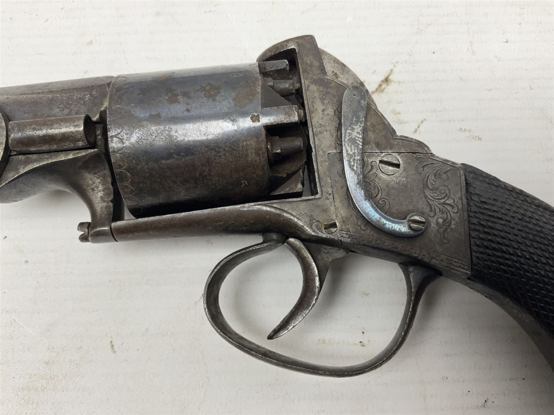 Mid-19th century Smith London .36 cal. transitional five-shot percussion revolver, the 12cm rifled octagonal barrel with side loading lever, side safety, some engraved decoration and chequered two-piece grip L28cm overall