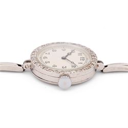 Audemars Piguet & Co Art Deco ladies platinum, diamond set manual wind wristwatch, movement No. 19931, cream / silvered dial with Arabic hour markers, the bezel milgrain set with round cut diamonds, to a platinum expanding bracelet