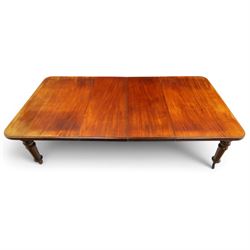 19th century mahogany extending dining table, rectangular top with rounded corners raised on turned and fluted supports with brass cups and castors, with two additional leaves; with set of eight (6+2) Regency design mahogany dining chairs, spiral-reeded back-bar over drop-in seats and sabre supports (W54cm H85cm)