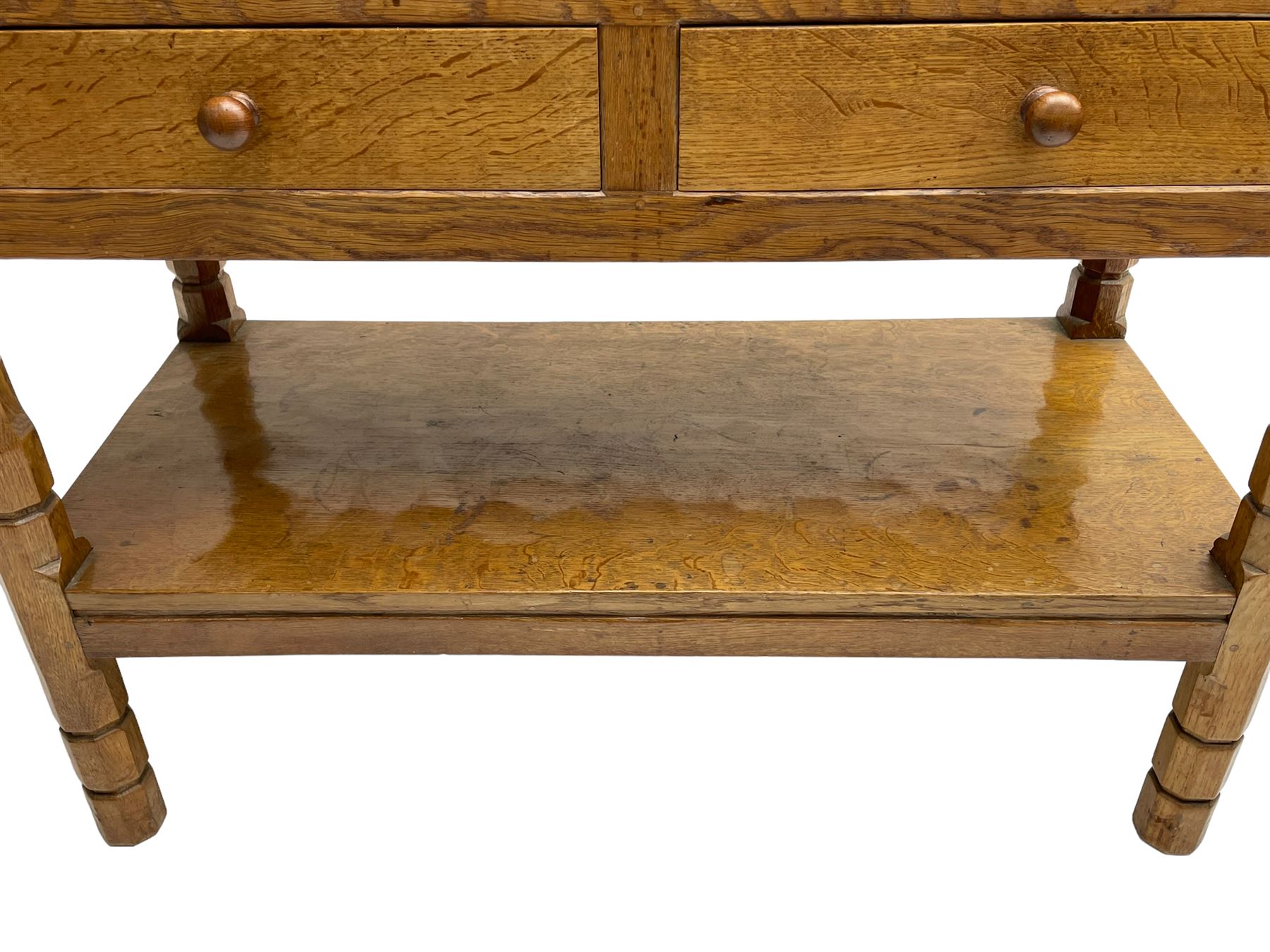 Mouseman - circa. 1950s oak serving table, adzed rectangular top over two drawers, on octagonal supports joined by adzed undertier, the rear right leg carved with mouse signature, by Robert Thompson of Kilburn