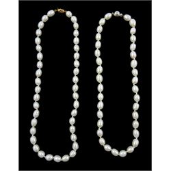 Two single strand white cultured pearl necklaces, one with 14ct white gold clasp, the other with 9ct yellow gold clasp