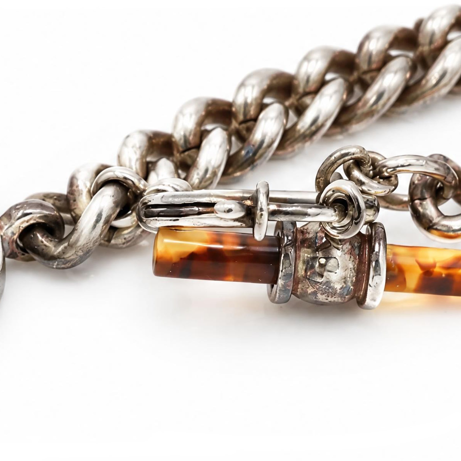 Ralph Lauren silver-plated curb link chain bracelet, with simulated tortoiseshell T bar and charm